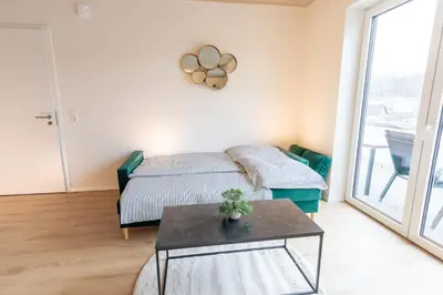Ein Bett oder Betten in einem Zimmer der Unterkunft Pitlane Apartment 3