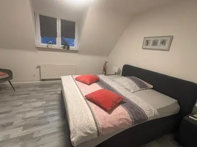 Ein Bett oder Betten in einem Zimmer der Unterkunft Erica Ferienwohnung auf dem Traumpfad