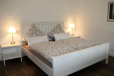 Ein Bett oder Betten in einem Zimmer der Unterkunft Ferienwohnung Am Gartenzaun