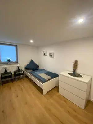 Ein Bett oder Betten in einem Zimmer der Unterkunft Charmantes Haus im Zentrum von Andernach