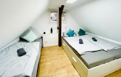 Ein Bett oder Betten in einem Zimmer der Unterkunft Traumhaus an der Lahn- Dreamhouse at River Lahn
