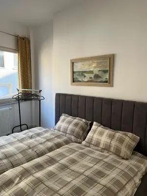Ein Bett oder Betten in einem Zimmer der Unterkunft Ferienwohnung Andi