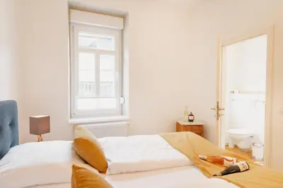 Ein Bett oder Betten in einem Zimmer der Unterkunft St Jakobshof für Moselurlaub mit Familie