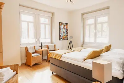 Ein Bett oder Betten in einem Zimmer der Unterkunft St Jakobshof für Moselurlaub mit Familie