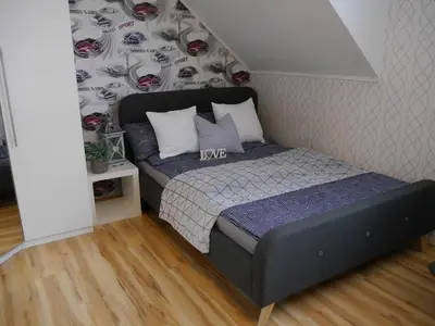Ein Bett oder Betten in einem Zimmer der Unterkunft Ferienhaus Bitburg