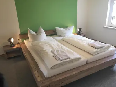 Ein Bett oder Betten in einem Zimmer der Unterkunft Herrenhaus