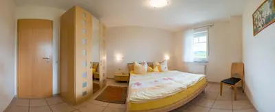 Ein Bett oder Betten in einem Zimmer der Unterkunft Ferienweingut Winnebeck