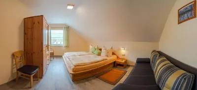 Ein Bett oder Betten in einem Zimmer der Unterkunft Ferienweingut Winnebeck