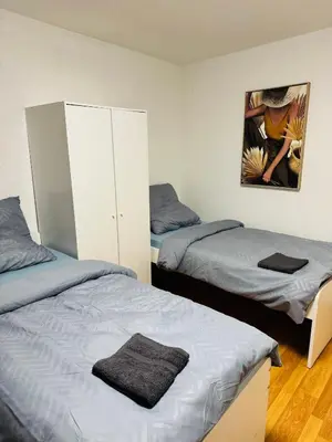 Ein Bett oder Betten in einem Zimmer der Unterkunft Unabhängiges Twin-Apartment