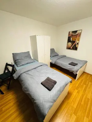 Ein Bett oder Betten in einem Zimmer der Unterkunft Unabhängiges Twin-Apartment