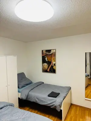 Ein Bett oder Betten in einem Zimmer der Unterkunft Unabhängiges Twin-Apartment