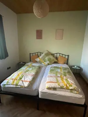 Ein Bett oder Betten in einem Zimmer der Unterkunft Ferienwohnung mit Aussicht