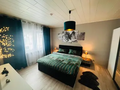 Ein Bett oder Betten in einem Zimmer der Unterkunft Exklusive großzügige Wohnung