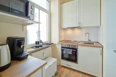 Küche/Küchenzeile in der Unterkunft MARX - Studio-Apartment im Zentrum von Trier - Top-Lage, Gratis WLAN, ideal für Paare & Geschäftsreisende