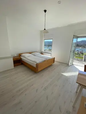 Ein Bett oder Betten in einem Zimmer der Unterkunft Hotel Rheinblick