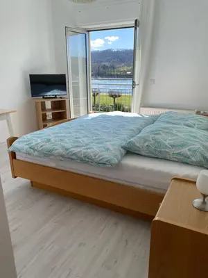 Ein Bett oder Betten in einem Zimmer der Unterkunft Hotel Rheinblick