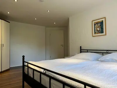 Ein Bett oder Betten in einem Zimmer der Unterkunft Wohlfühlnest im Ahornweg, Ferienwohnung