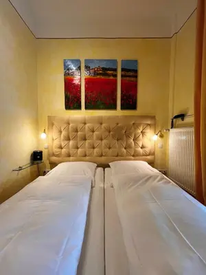 Ein Bett oder Betten in einem Zimmer der Unterkunft Provence am Kurpark
