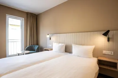 Ein Bett oder Betten in einem Zimmer der Unterkunft May Hotel Mayschoß
