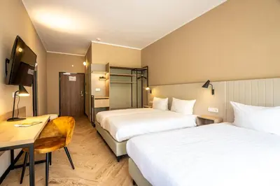 Ein Bett oder Betten in einem Zimmer der Unterkunft May Hotel Mayschoß