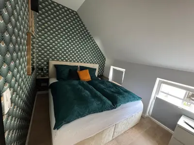 Ein Bett oder Betten in einem Zimmer der Unterkunft Modernes Appartement am Luisenhof