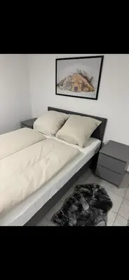 Ein Bett oder Betten in einem Zimmer der Unterkunft Ruhige, gemütliche Wohnung, 2 Betten