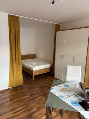 Ein Bett oder Betten in einem Zimmer der Unterkunft Ferienwohnungen im Taunusblick