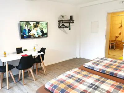 Ein Bett oder Betten in einem Zimmer der Unterkunft Speedy's Gästehaus