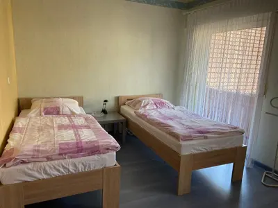 Ein Bett oder Betten in einem Zimmer der Unterkunft Ferienhaus im schönen Winzerdorf Kirschroth mit Sonnenterrasse und Wintergarten