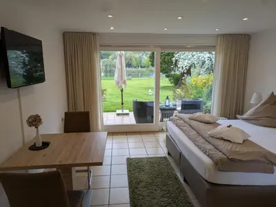 Ein Bett oder Betten in einem Zimmer der Unterkunft Ferienwohnungen Lohmann