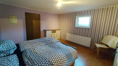 Ein Bett oder Betten in einem Zimmer der Unterkunft Ferienwohnung Thielen