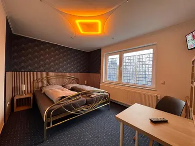 Ein Bett oder Betten in einem Zimmer der Unterkunft Haus Mia Low Budget Apartment