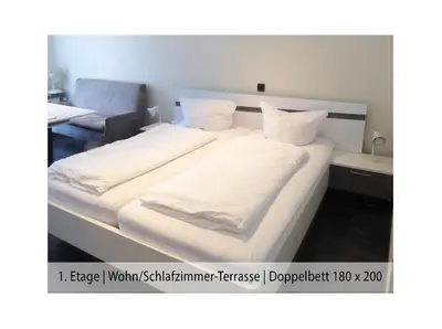 Ein Bett oder Betten in einem Zimmer der Unterkunft Ferienwohnung Trier Stadtmitte/Fußgängerzone