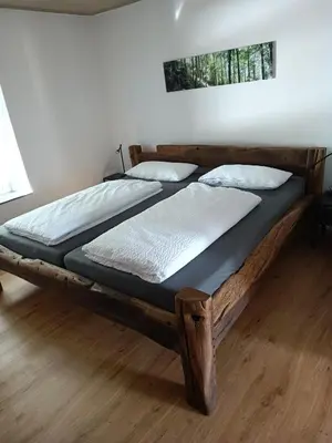 Ein Bett oder Betten in einem Zimmer der Unterkunft Eifel-Ferienhaus, Haus Achtzehn77