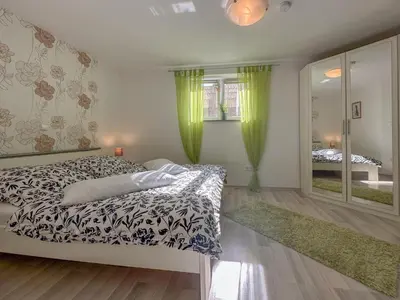 Ein Bett oder Betten in einem Zimmer der Unterkunft Bianka