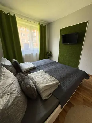 Ein Bett oder Betten in einem Zimmer der Unterkunft Schöne Wohnung in ruhiger Lage II