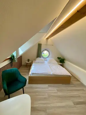 Ein Bett oder Betten in einem Zimmer der Unterkunft Ferienhaus Dudeldorf