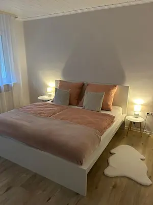 Ein Bett oder Betten in einem Zimmer der Unterkunft Ferienwohnung - Am Eisenberg