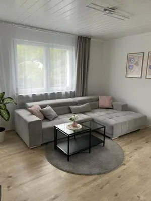 Ein Sitzbereich in der Unterkunft Ferienwohnung - Am Eisenberg