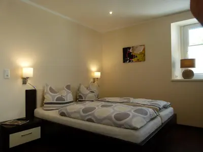 Ein Bett oder Betten in einem Zimmer der Unterkunft Mosel-Apart Rudorfer