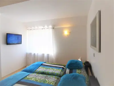 Ein Bett oder Betten in einem Zimmer der Unterkunft Sonnenhaus Ferienwohnungen