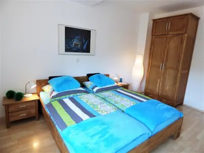 Ein Bett oder Betten in einem Zimmer der Unterkunft Sonnenhaus Ferienwohnungen