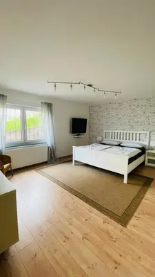Ein Bett oder Betten in einem Zimmer der Unterkunft FeWo Merxheim