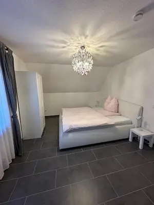 Ein Bett oder Betten in einem Zimmer der Unterkunft Ferienwohnung JODIS