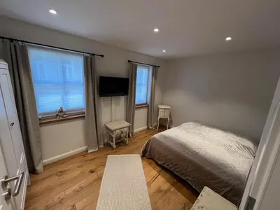 Ein Bett oder Betten in einem Zimmer der Unterkunft Ferienhaus Fachwerk Sanct Peter