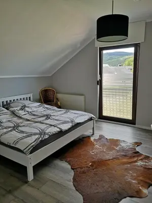 Ein Bett oder Betten in einem Zimmer der Unterkunft Ferienwohnung 