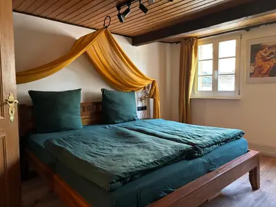 Ein Bett oder Betten in einem Zimmer der Unterkunft Fuchsbau