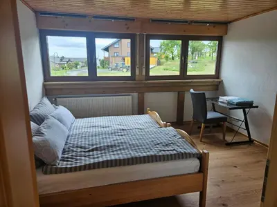 Ein Bett oder Betten in einem Zimmer der Unterkunft Ferienwohnung Meuspath