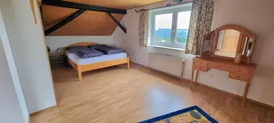 Ein Bett oder Betten in einem Zimmer der Unterkunft Landhaus Sauerburgblick