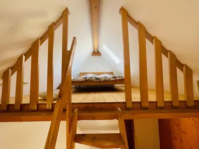 Ein Bett oder Betten in einem Zimmer der Unterkunft Ehemaliges Wein Chateau
